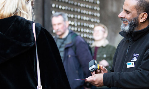 Admissions Assistant, Sherif Mehareb, checking tickets at the entrance to Edinburgh Castle