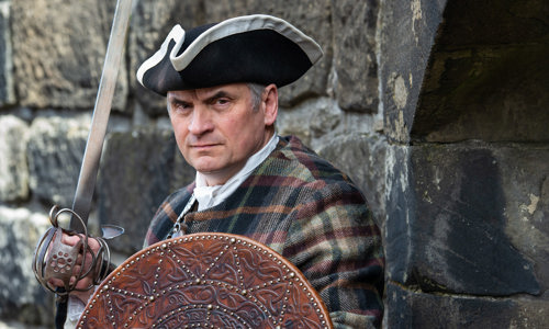 Costumed performer taking the Rebels and Redcoats performance