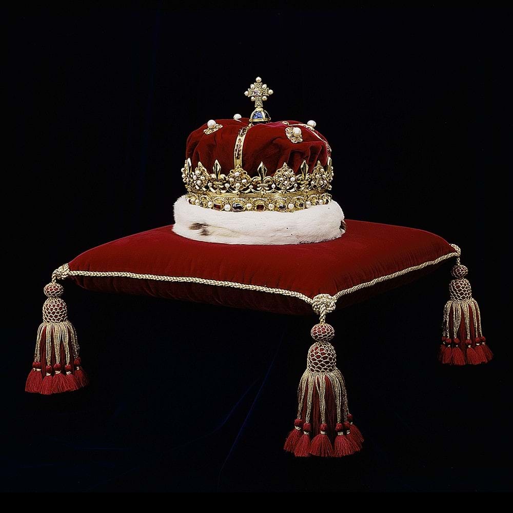 Crown with bonnet on a cushion