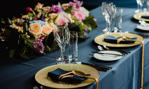 Detailed image of table settings and flowers in the Gatehouse Suite