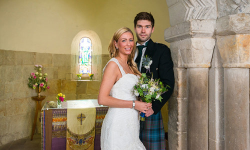 A bride and groom inside St Margaret's Chapel
