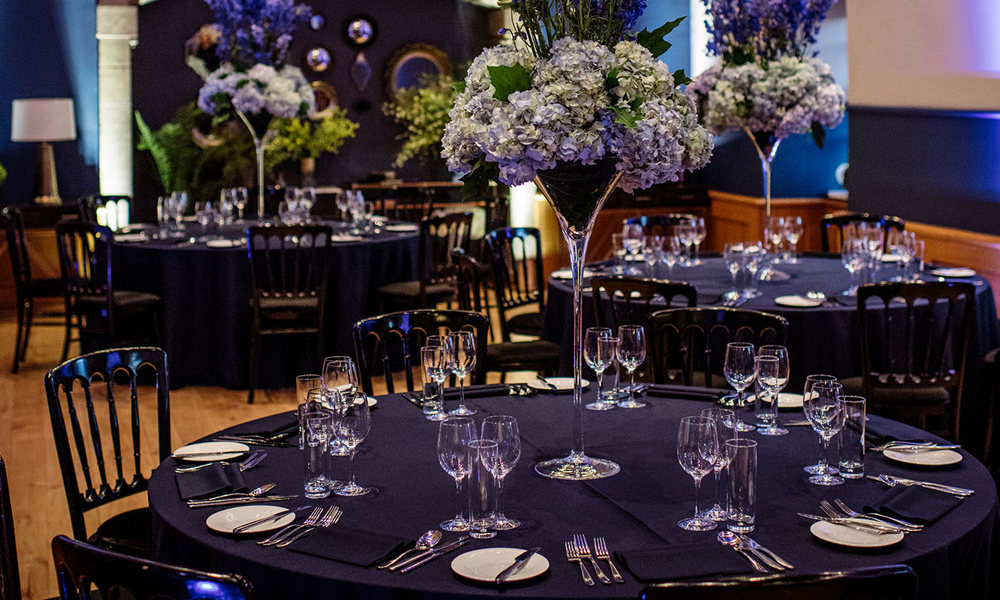 General view of the Queen Anne Room set up for a corporate dinner