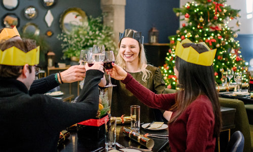 Visitors enjoying Christmas lunch in the Queen Anne Cafe