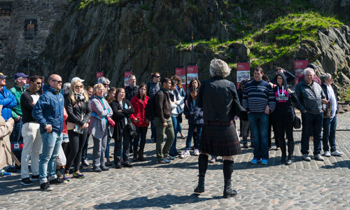 A steward giving a guided tour of Edinburgh Castle