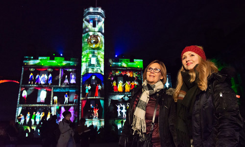 Two woman in Crown Square at the Castle of Light event