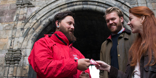 A member of staff scanning entry tickets