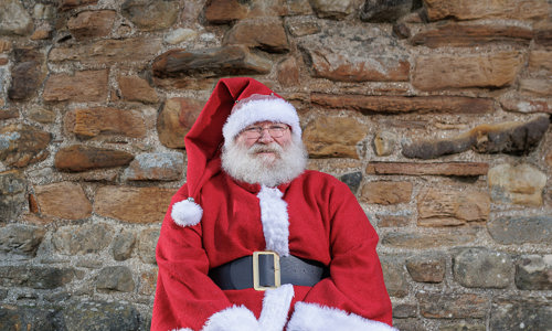 A man dressed in a Santa Claus outfit